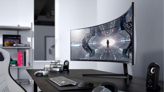 Desktop showing large curved gaming monitor