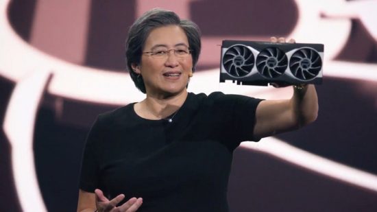 Lady holding up a PC graphics card