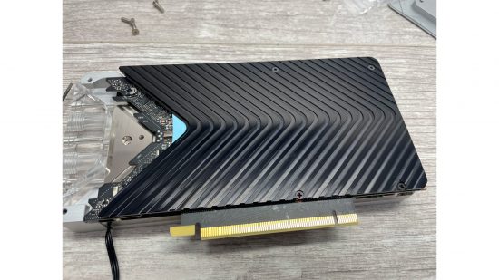A waterblock backplate secured to an RTX 3080 GPU
