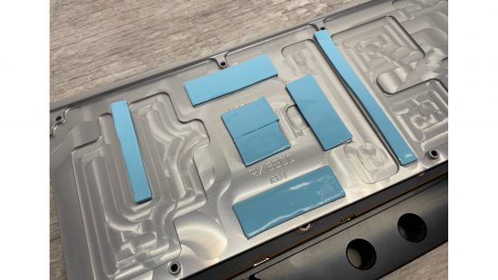 A waterblock backplate, with blue thermal pads