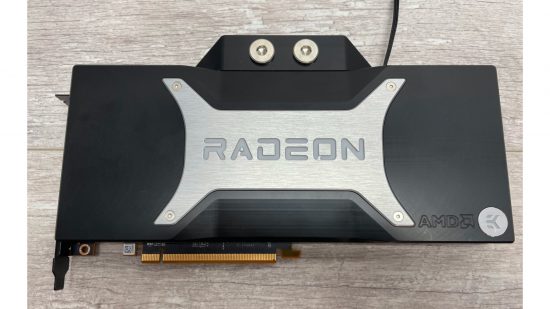 An AMD Radeon RX 6800 XT GPU with a waterblock fitted, including port bungs