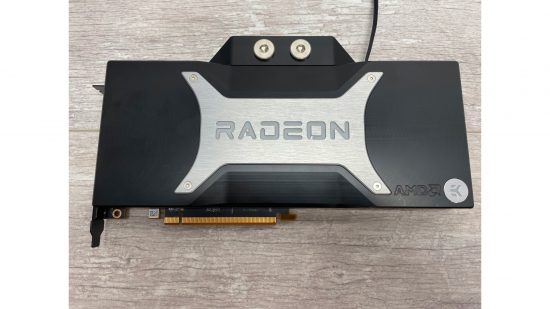 An AMD Radeon RX 6800 XT GPU with a waterblock fitted, including port bungs