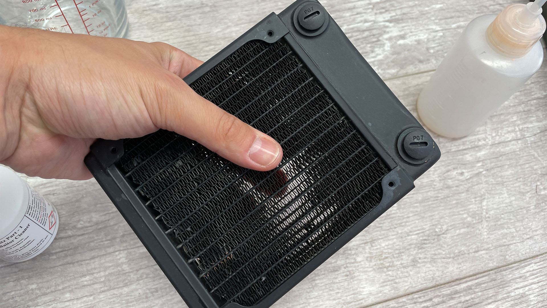 Shaking a water-cooling radiator to clean it