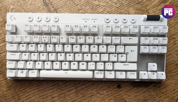 Logitech G Pro X TKL Lightspeed review: a white keyboard appears on a wooden worktop.