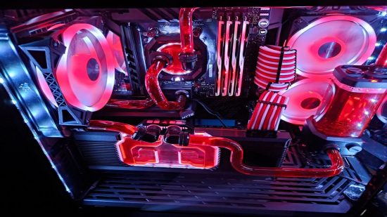 A top-down side view of the Red Queen PC build that shows off the water cooling system that was implemented into the PC